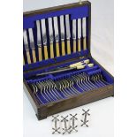 20th century oak cased silver plated cutlery set to include four knife rests