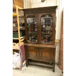 Early 20th century Oak Bookcase Cupboard, with twin leaded glazed doors and three adjustable shelves