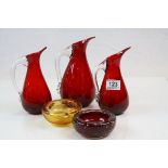 Three Ruby glass Sparrow beak Whitefriars jugs and two Controlled bubble bowls, tallest jug approx