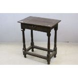*17th century Small Oak Side Table, the plank top above a single frieze drawer with brass swan