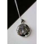 Silver photo locket set with an embossed bee decoration