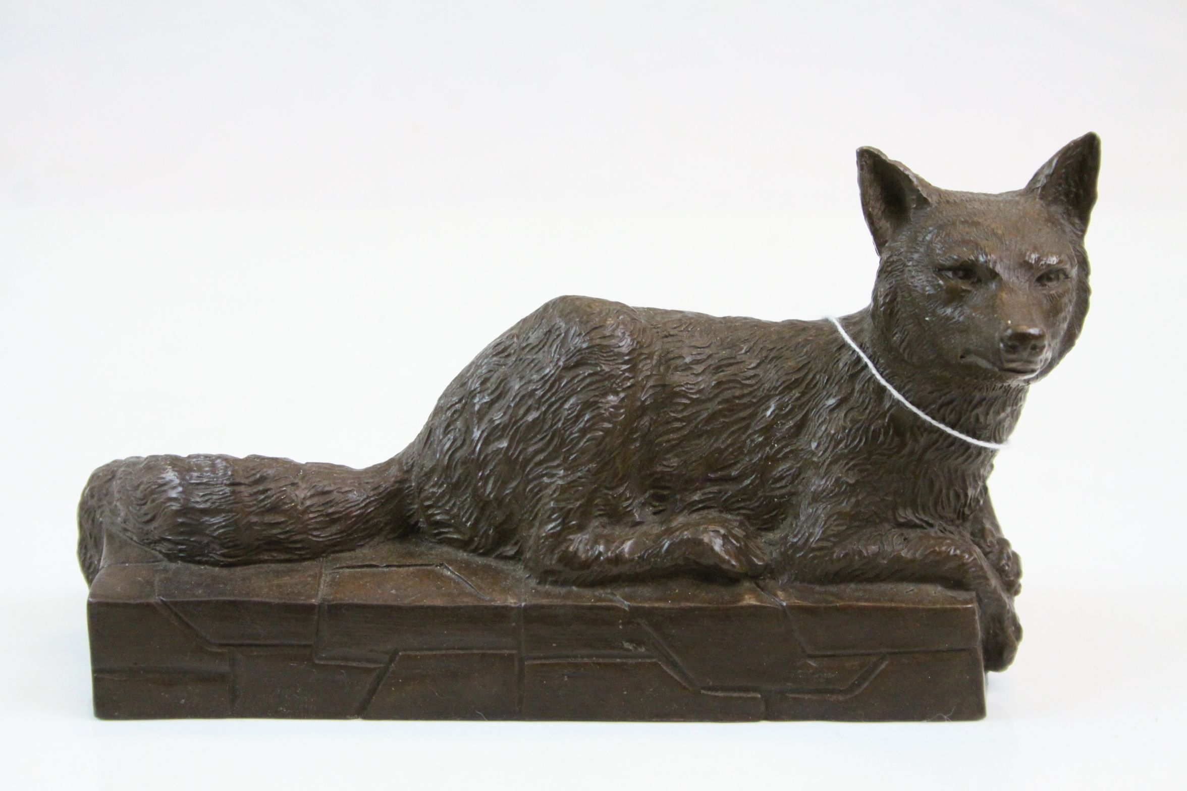 Bronze recumbent fox wall