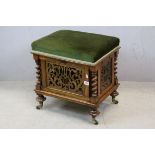 19th century Walnut Piano Stool, the padded upholstered Seat opening to reveal Three Sheet Music