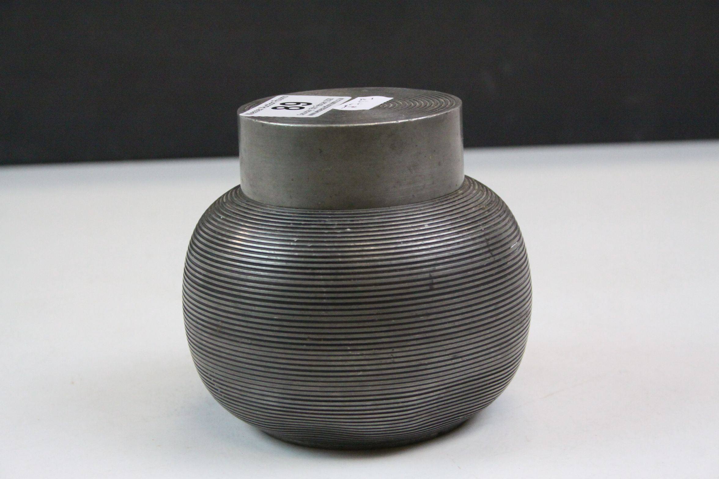 Pewter tea caddy of spherical reeded form, complete with interior lid and cover, height