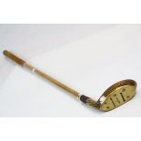 Contemporary St Andrews wood and brass putter