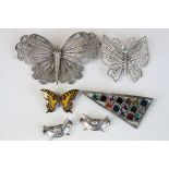 Three butterfly brooches and two white metal golf club lapel badges