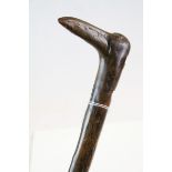 Rustic gnarled walking stick with stylised birds head handle