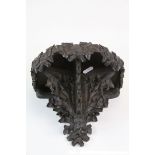 Finely carved Black Forest Wooden Shelf with Vine decoration, measures approx 21 x 18 x 15.5cm
