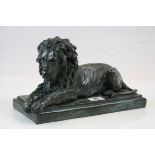 Patinated bronze effect model of a recumbent Lion, signed R Moll and numbered 347/750, measures