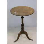 *George III Oak Tripod Table, the circular top on turned shaft with tripod base terminating in