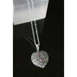 Silver heart shaped necklace inset with rubilite's