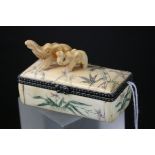 Hand carved bone jewellery box with two carved elephants on lid