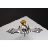 Boxed white metal Thistle Brooch set with yellow stone