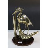 Brass model of a Heron on Lily pad with circular wooden base, stands approx 37cm