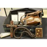 Suitcase of sundries, to include early 20th century cat 'o nine tails, a similar crucifix, gun