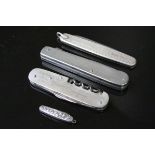 Four Pocket knives to include a Miniature example, one with fold out Fork, an Advertising