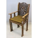 Inidan Hardwood Elbow Hall Chair with profuse blind and pierced foliate carving, hard seat and
