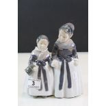 Royal Copenhagen ceramic model of two Girls in Traditional dress, holding hands, marked 1316