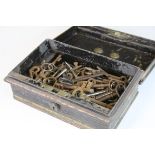 Metal tin containing a quantity of antique keys