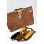 Mid 20th century leather attache case, together with an oak shield barometer with clothes brushes