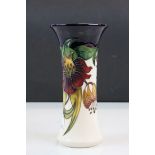 Moorcroft Pottery vase with flared rim in Anna Lily pattern, stands approx 20.5cm