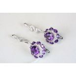 Pair of silver CZ and amethyst drop earrings in the form of snakes