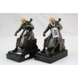 Pair of contemporary book ends in the form of cellists raised on marble bases