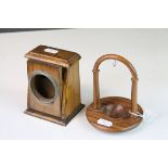Two wooden pocket watch stands, both different types