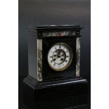 Antique black slate mantle clock with marble supports, two train movement