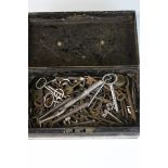 Metal tin containing a quantity of antique keys