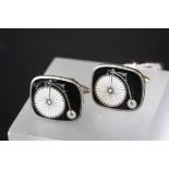 Pair of contemporary white metal and enamel cufflinks with penny farthing bicycle decoration