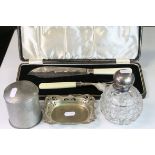 Silver topped cut glass dressing table bottle with stopper, a pair of cased ivorine handled EPNS