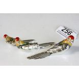 Set of three silver and enamel saturno graduated parrots