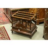 *Walnut Canterbury, the four turned uprights with turned finials, the lower section containing a