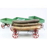Three Mamod trailers plus a Mamod log carrier with logs