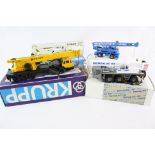 Four boxed 1:50 construction diecast models to include Conrad 2086 Demag AC155, Gescha Krupp