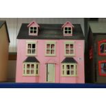 Wooden pink and grey dolls house, containing wooden furniture
