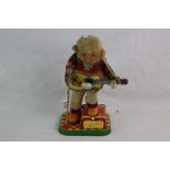 Alps of Japan tin plate 'Rock & Roll' playing monkey with guitar and microphone