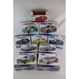 9 boxed & sealed 1:24 Burago metal kits to include 5551 Porsche 356, 5563 Porsche 959, 5520 VW