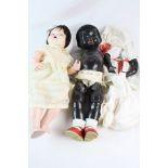 Two mid 20th C dolls to include a Pedigree black doll (head separated from body)