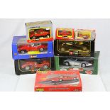 Seven boxed diecast model vehicles to include 1:18 Burago 1961 Jaguar E Cabriolet, 1:20 Burago