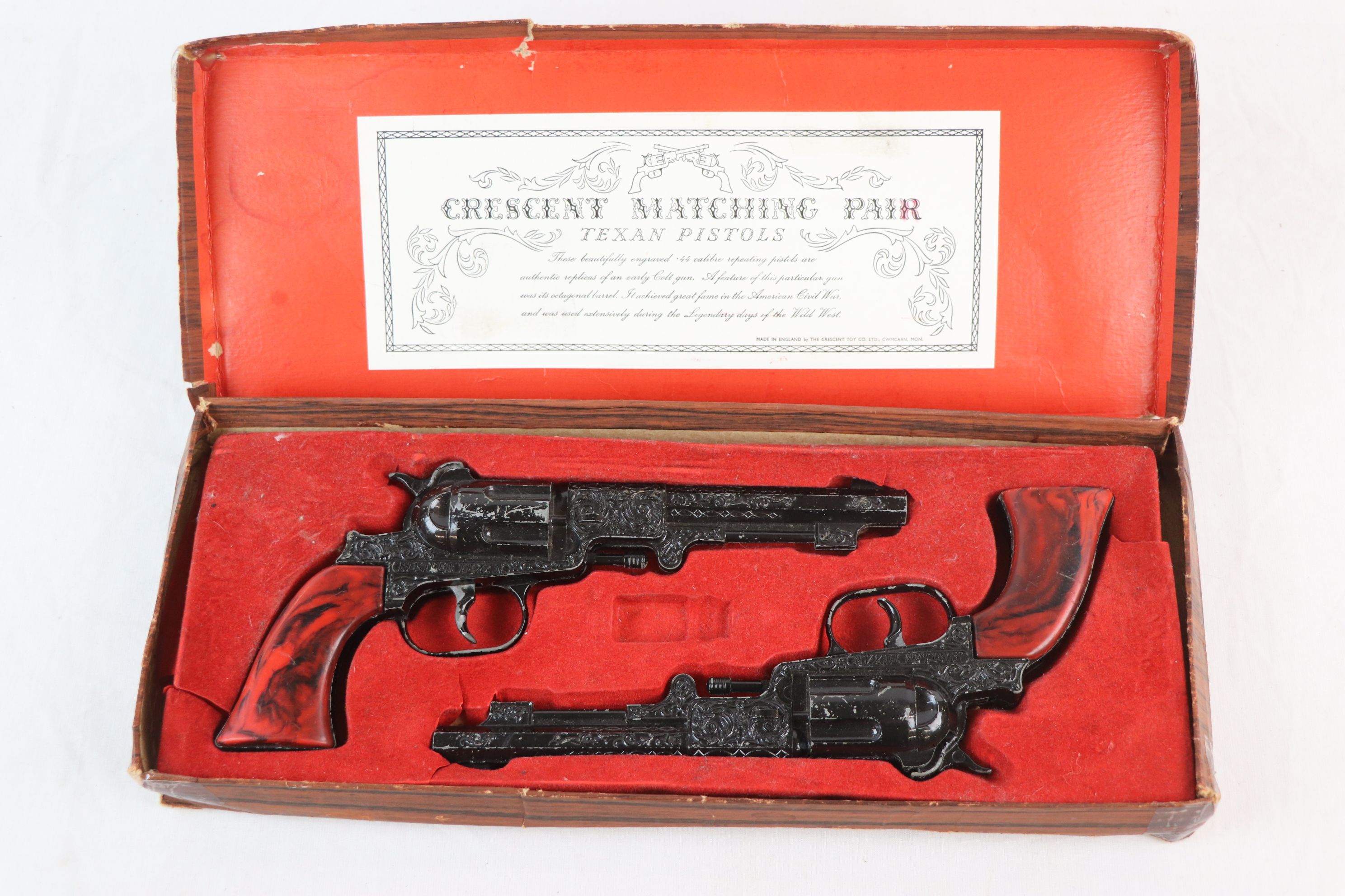 Boxed Crescent Matching Pair Texan Pistols black & red finish