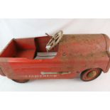 Mid 20th C metal pedal car 'Lightning' in red, rusted and worn