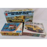 Three boxed model kits to include 1:25 AMT T558 Caterpillar D8H Bulldozer and Lowboy trailer, ERTL