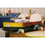 Scratch built wooden remote control boat "Sara", painted yellow, green, white and black on wooden
