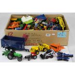 Large quantity of loose, playworn, diecast tractors and agricultural implements to include