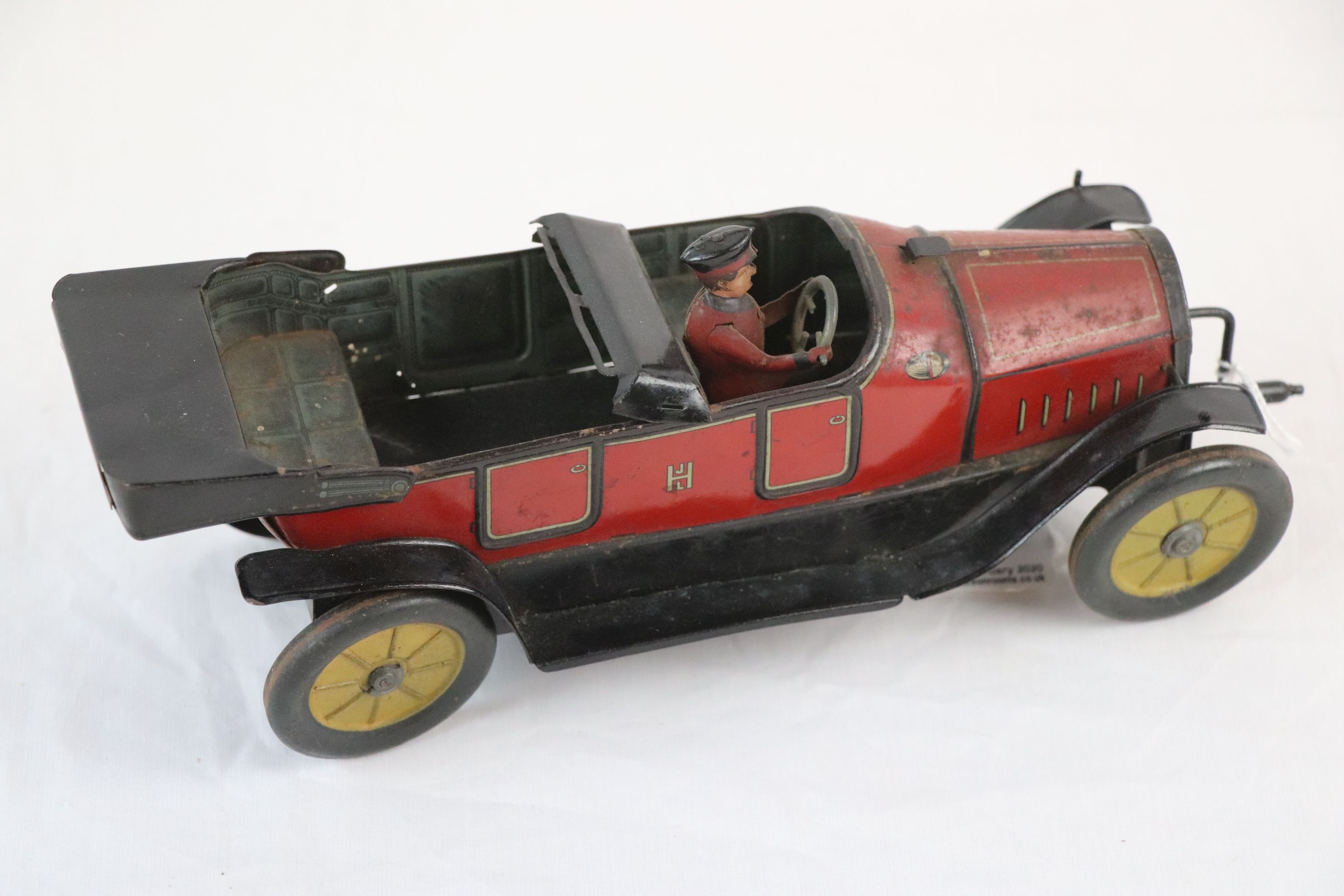 Early-mid 20th C HJL tin plate car with driver, in red with black, gd overall condition