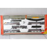 Boxed Hornby OO gauge R543 Advanced Passenger Train Set appearing complete with engine and rolling