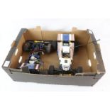 Two vintage 1/10 scale Tamiya electric The Boomerang (58055) remote control cars.