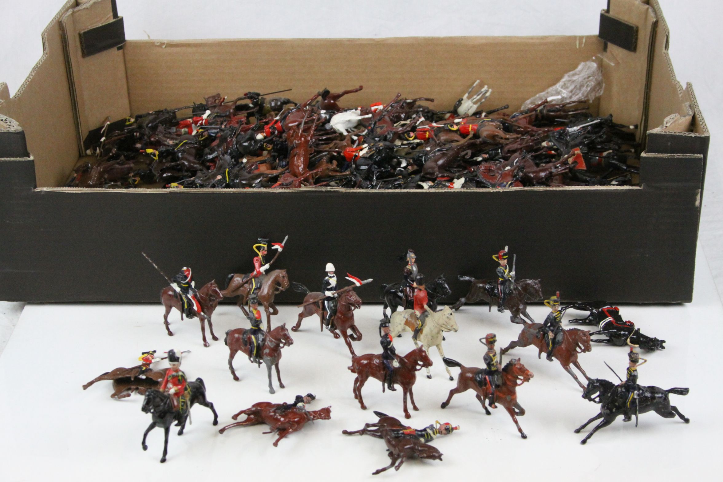 Large collection of loose diecast soldiers on horseback, mostly Britains, many different regiments